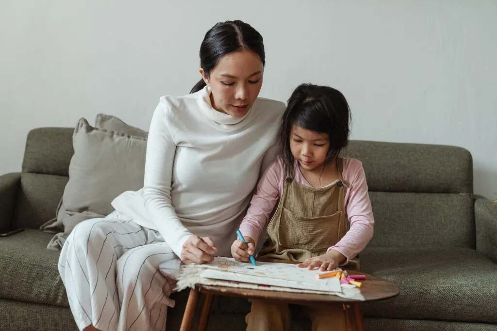 Woman teaching a child with Learning Disabilities