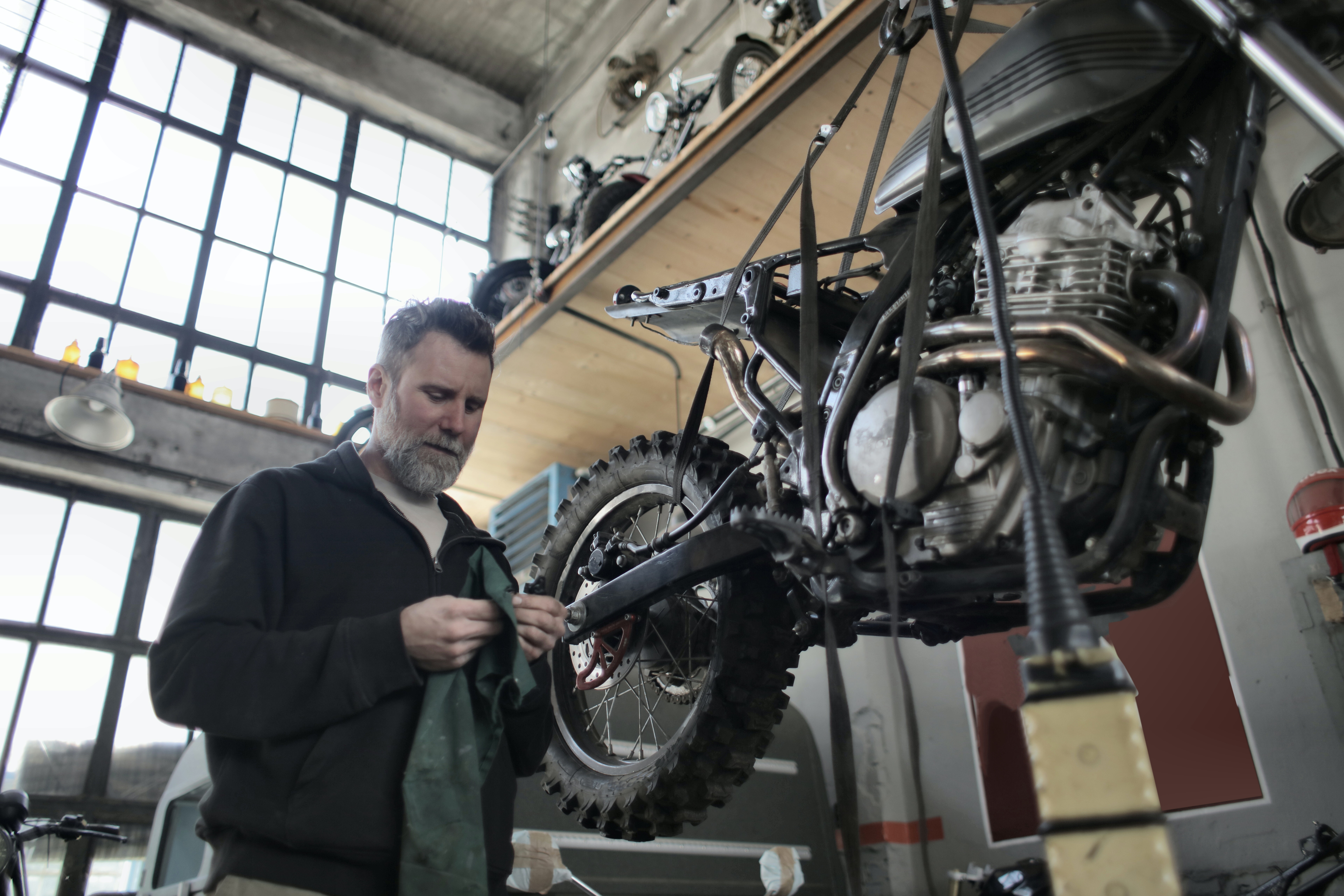 man working to improve the bike