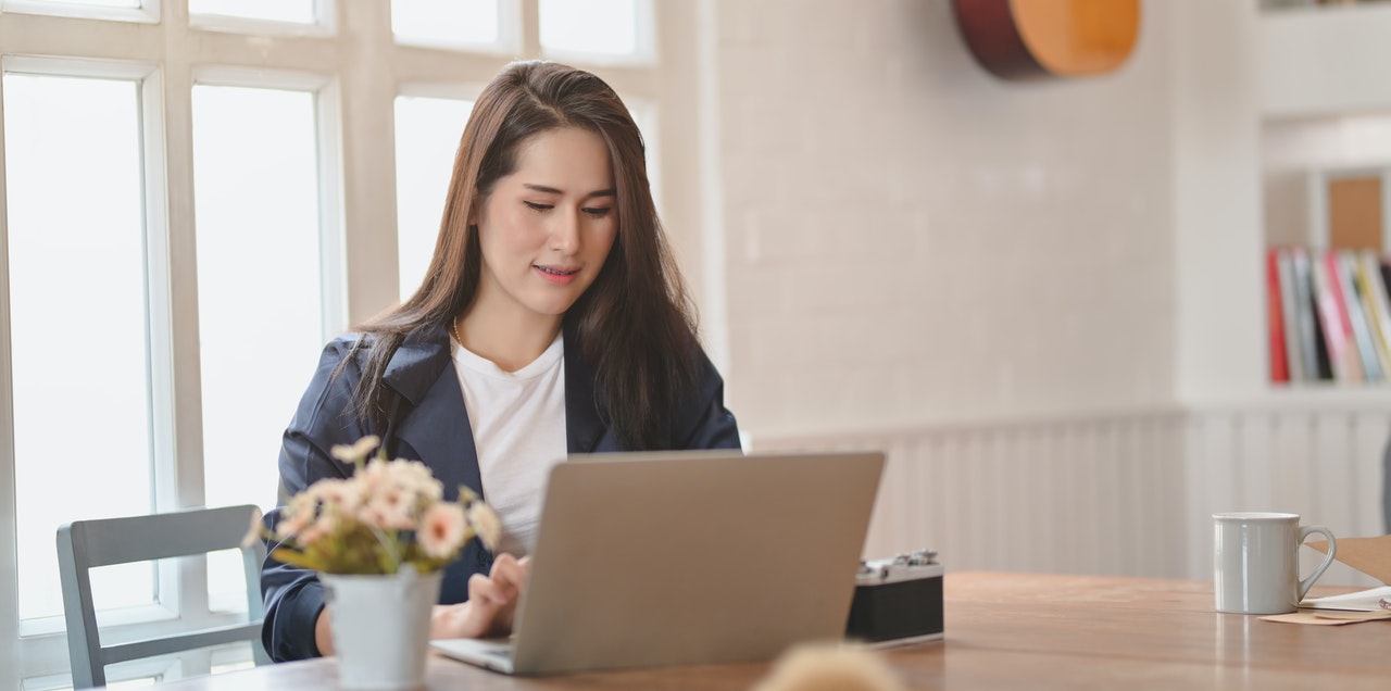 Woman reading on computer