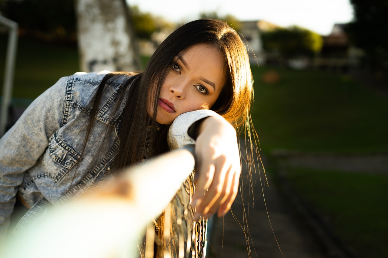 ENFP woman leaning on a railing