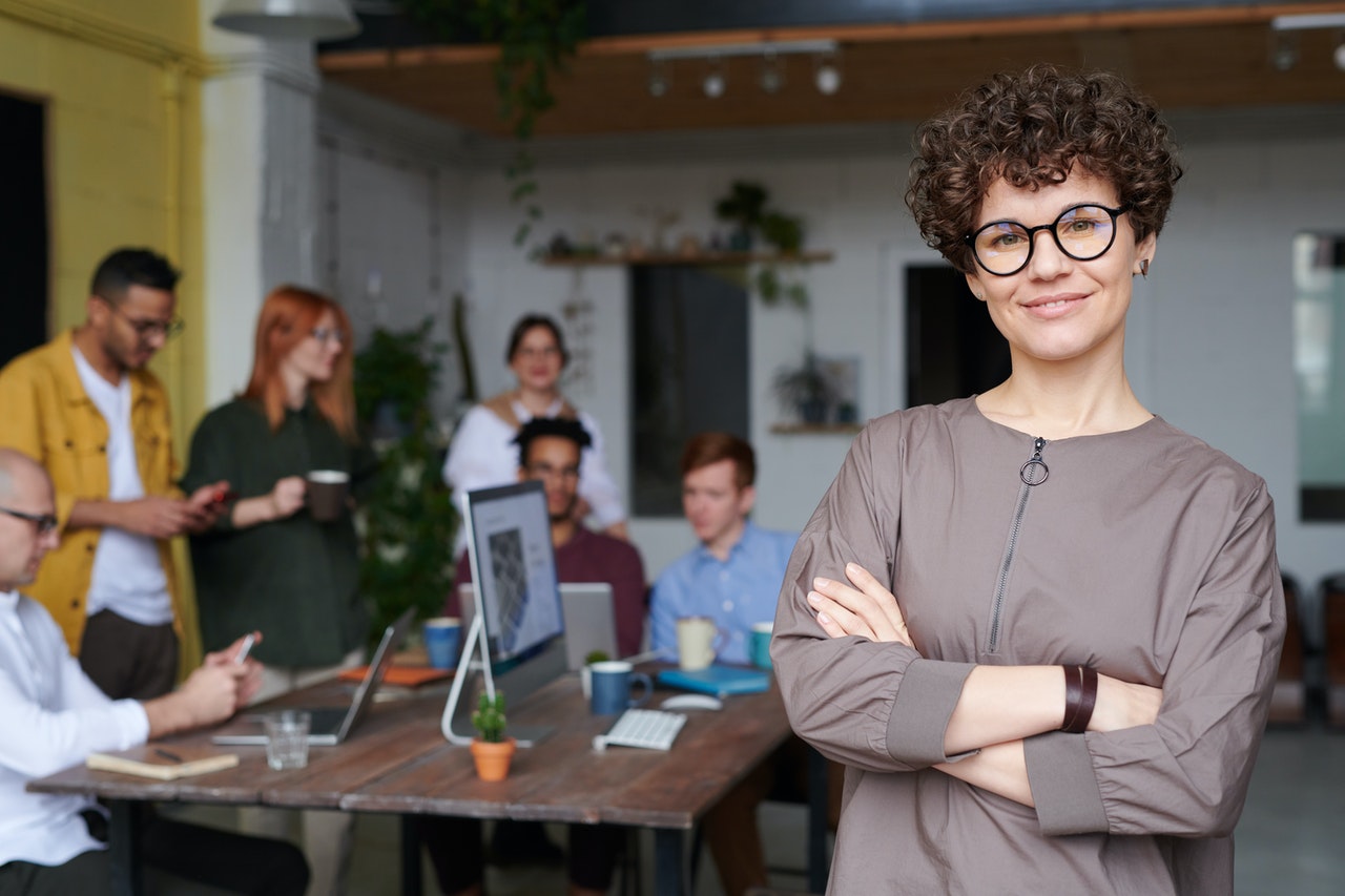 Woman with her team behind