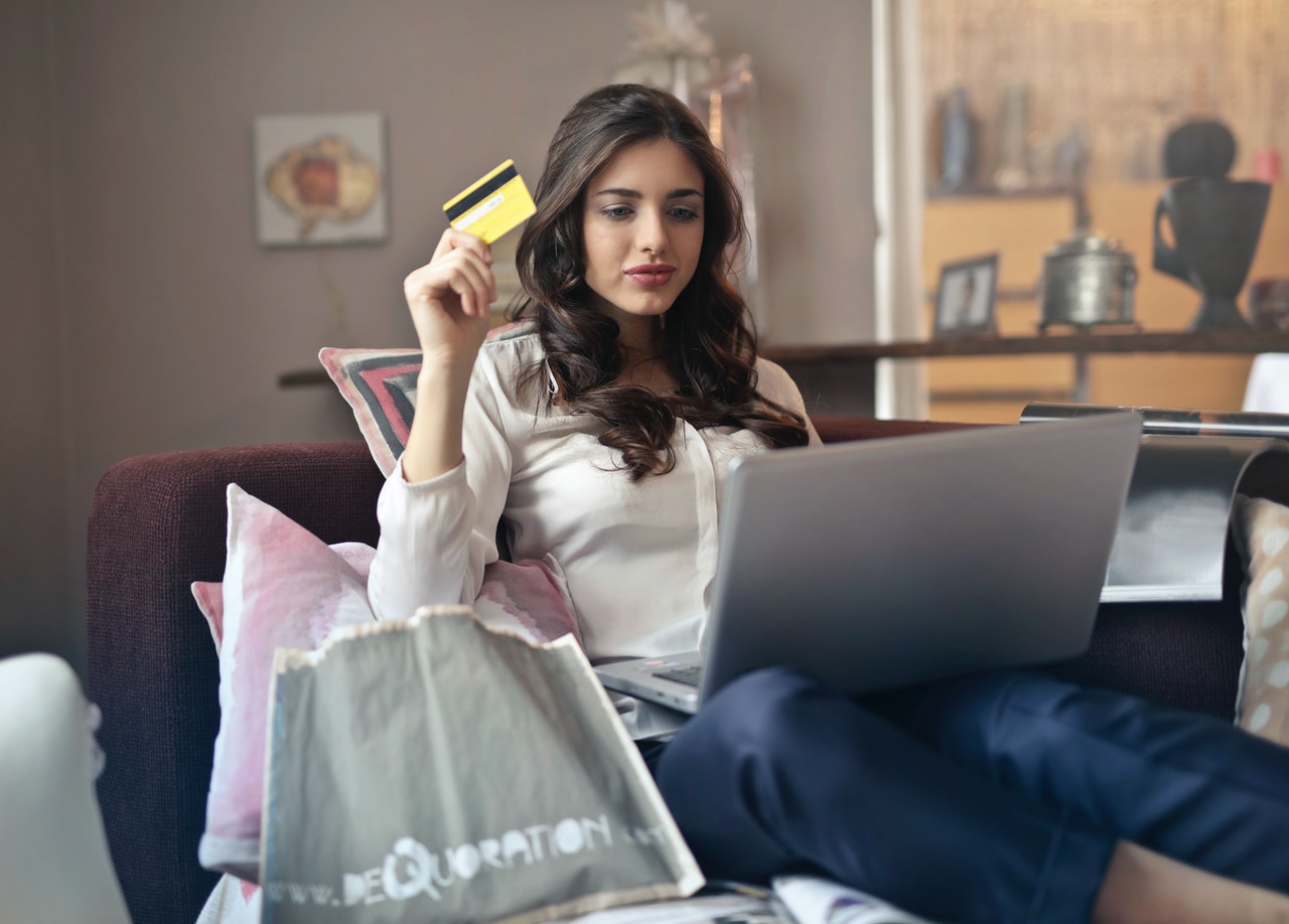 Woman using her credit card online