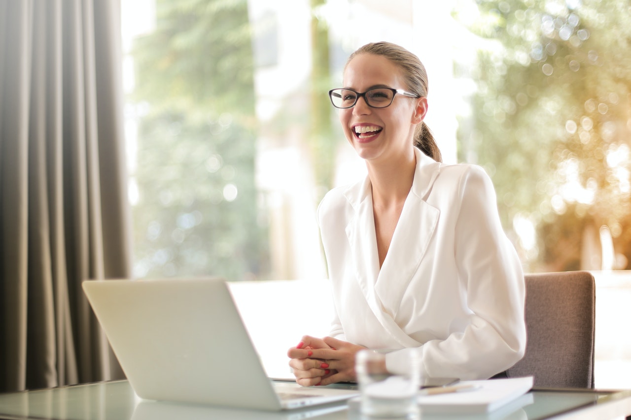 Woman communicating Management theories happily