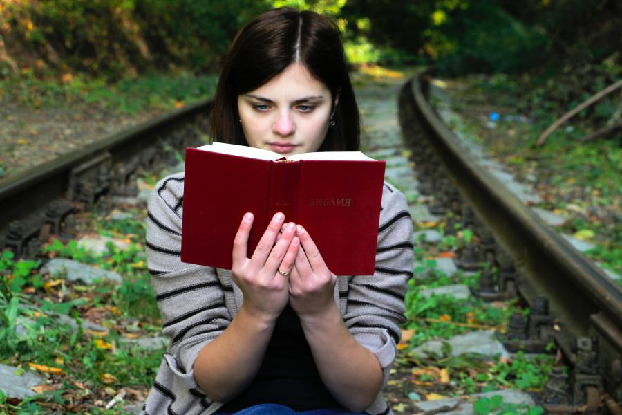 Satisfied woman book reader after applying Six Sigma for book publishing