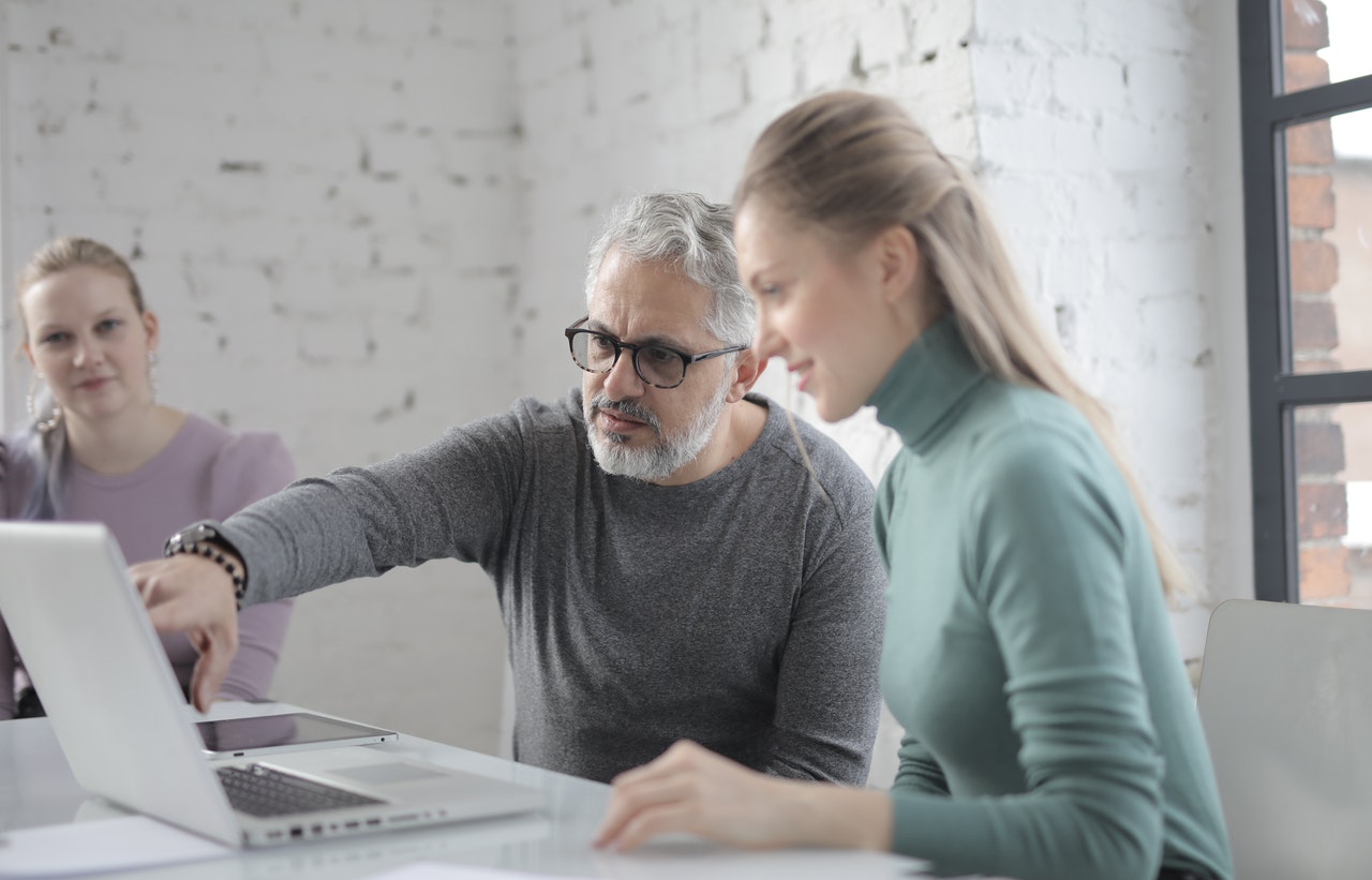 mature couple looking at PC