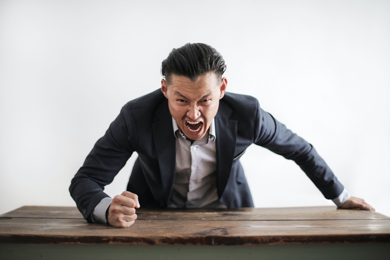 Man showing workplace harassment behavior